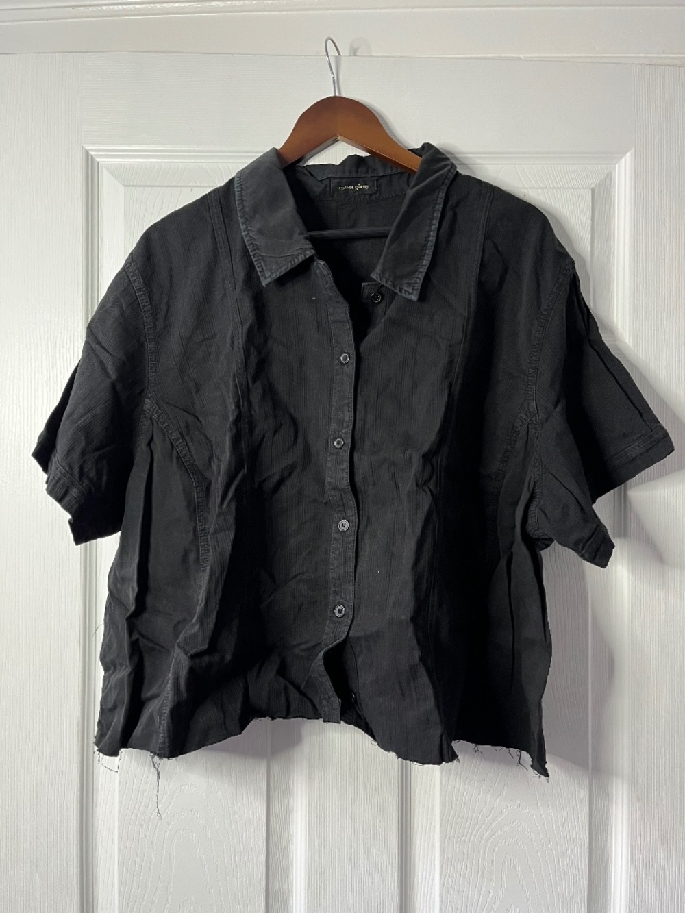 Black button-up short-sleeved shirt